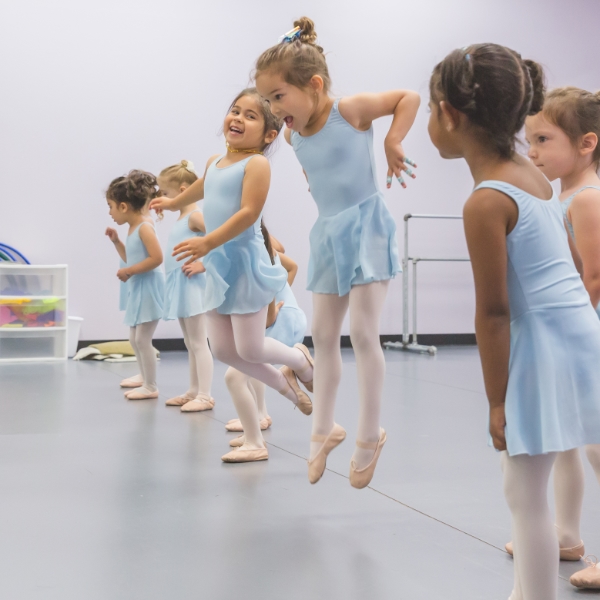 Bluebells dancers leaping.