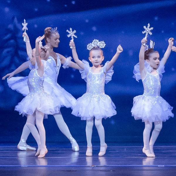 Snow Flurry Dancers with snowflake wands.