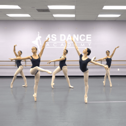 Photo of advanced ballet dancers posing in the studio.